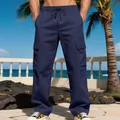 Men's navy blue cargo pants detail featuring large side pockets and drawstring waist - XS / Bottoms / Navy Blue