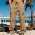 Detailed view of men's khaki cargo pants with multiple pockets and drawstring waist - XS / Bottoms / Khaki