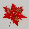 Close-up of red velvet artificial Christmas flower with gold sequins and glitter edges - Red