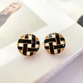 Detail view of vintage circular hollow enamel earrings with 925 silver needles. - Round Black