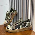 Detailed side and top view of women's camouflage canvas sneakers with durable flat soles - 36 / Camouflage