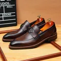 Premium dark brown leather loafers for men featuring a stylish metal buckle ornament - 37 / Coffee