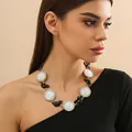 Close-up of cameo relief portrait necklace with rhinestone borders on model - Black Cat