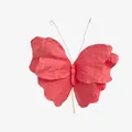 Macro view of handmade pink crumpled paper butterfly with wire antennae for display - Pink