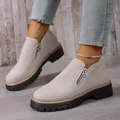 Close-up of women's light gray suede loafers featuring a side zipper and lug sole - 36 / Beige