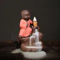 Handcrafted purple clay backflow incense burner featuring a cute monk on a mountain - Kung Fu Boy (Red)