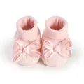 Close-up of soft pink baby girl lace socks with elegant ribbon bows for newborns - 11cm / Red