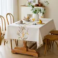 Detailed view of cream embroidered tablecloth with yellow floral patterns and fringe tassels. - Plum Blossom Snow Branch / 140*100cm / Brown