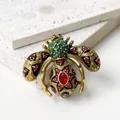 Detail showing the intricate enamel and rhinestone work on a vintage bee brooch pin. - Bee Style / Colorful