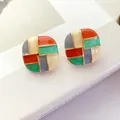 Close-up of vintage colorful patchwork enamel stud earrings with elegant gold-toned trim - Square Multicolor
