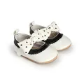 Detail view of stylish baby girl princess shoes with polka dot bows for first walkers - Insole Length 11cm / Black