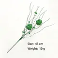 Close-up detail of 43cm glittery green four-leaf clover spray for St. Patrick's Day decor - Green Clover