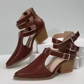 Stylish brown pointed-toe Roman boots featuring chunky heels and multiple buckle straps - 36 / Brown