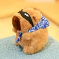 Adorable soft capybara plush toy featuring a blue paisley bandana and stylish black headband - Approx. 12cm / Capybara Backpack Thief