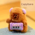 Adorable brown capybara plush toy featuring a purple keyboard and matching ear muffs - Musical Plush Toy Holding Keyboard - Long Mink Fur