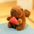 Cute brown capybara plush toy holding a small red watermelon slice toy accessory - Angel Capybara Watermelon