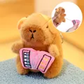 Cute capybara plush keychain with pink accordion and a pull-string vibration feature - Quick-Pull Toy Accordion