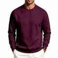 Detail of a men's burgundy crew neck sweatshirt showing the relaxed fit and rich color. - Burgundy
