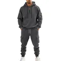 Full body view of a man in a heavy dark grey fleece hoodie and cargo jogger set. - Dark Gray