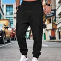 Vista dettagliata dei pantaloni cargo neri da uomo con trama a nido d'ape - Taglia S / Pantaloni e gonne / Nero