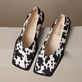 Macro view of trendy cow print pattern on square-toe platform loafers for women - 35 / Cow Print
