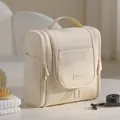 Premium beige hanging toiletry bag with multi-compartment design for travel use - Beige