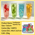 Transparent toothpaste tube squishy toy with colorful fruit slices for stress relief - Crystal Mud Filling / Toothpaste Squishy