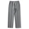 Close-up showing the grey waffle texture and elastic drawstring waist detail - S / Bottoms / Dark Gray