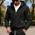 Close-up of black men's zip hoodie featuring tactical arm pockets and neon green accents. - M / Tops / Black
