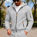 Detailed view of grey zip-up hoodie featuring utility arm pocket and orange accents - M / Tops / Light Gray