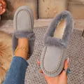 Elegant grey suede loafers featuring plush faux fur trim and lining for winter warmth - Gray