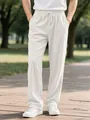 Detail shot of men's white corduroy casual pants with elastic drawstring waist. - S / Bottoms / White