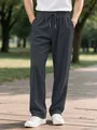 Detailed view of men's dark grey corduroy trousers featuring elastic drawstring waist - S / Bottoms / Gray