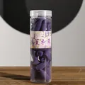 Scented purple lavender backflow incense cones in a clear plastic cylinder storage bottle - Lavender Scent / Purple