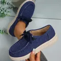 Close-up view of stylish blue denim lace-up loafers with a durable thick beige sole. - 36 / Blue