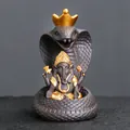 Handcrafted purple sand Ganesha incense burner with cobra and gold crown accents - Snake And Ganesha