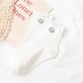 Soft white cotton crew socks featuring a cute minimalist black smiley face embroidery. - One Size / Circle Smiley Embroidery
