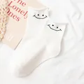 Sweet and cool white crew socks featuring a minimalist black embroidered smiley face design - One Size / Smile Embroidery