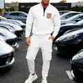 Close-up of white heavy fleece two-piece tracksuit with cargo pants and quarter-zip - S / Top And Bottom / White