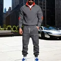 Men's grey heavyweight fleece tracksuit with orange trim in urban outdoor setting - S / Top And Bottom / Dark Gray