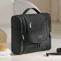 Large capacity black hanging toiletry bag with multiple compartments for travel toiletries - Black