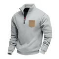 Detailed view of grey heavy fleece men's sweatshirt with quarter zip and tan chest pocket. - Light Gray