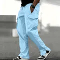 Close-up of light blue men's cargo pants featuring multiple pockets and ankle snaps. - S / Bottoms / Sky Blue