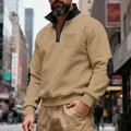 Detail of man wearing a khaki heavy fleece quarter-zip sweatshirt with elbow patches - S / Tops / Camel
