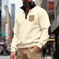 Detailed view of men's cream fleece quarter-zip sweatshirt with elbow patches. - Apricot