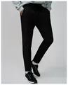 Close-up detail of men's black quick-dry breathable running pants worn by a model - S / Bottoms / Premium Black