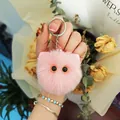 Cute pink plush cat head keychain charm for bags and car keys with fluffy fur texture - Korean Pink