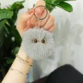 Cute gray plush cat head keychain charm shown held in hand for bag or car keys - Gray
