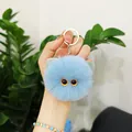 Cute light blue fluffy plush cat head monster keychain charm with large orange eyes - Sky Blue