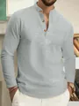 Detailed view of gray waffle knit Henley shirt for men with stylish wood buttons - S / Tops / Gray
